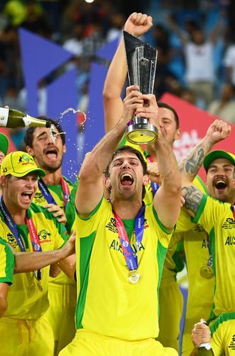 Mitchell Marsh of Australia lifts the ICC Men's T20 World Cup Trophy following during the ICC Men's T20 World Cup final match between New Zealand and Australia at Dubai International Stadium on November 14, 2021 in Dubai, United Arab Emirates.